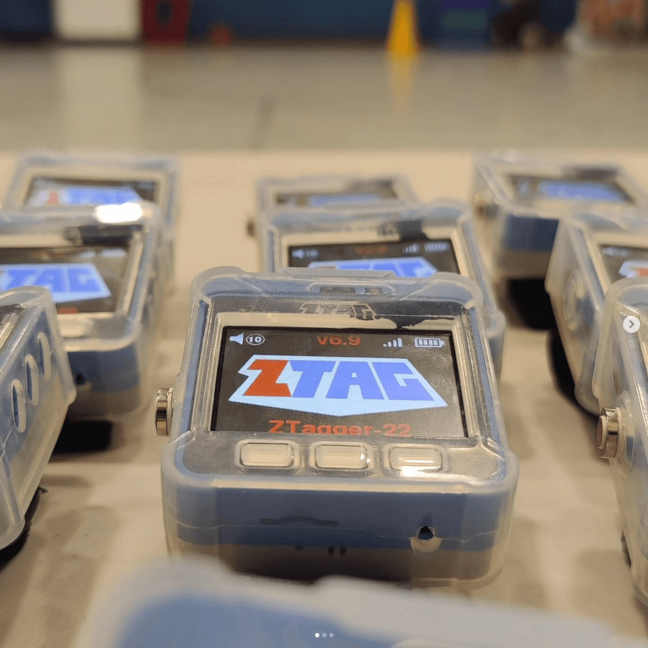 a ztag gunless laser tag device that appears to look like a watch it posed on top of a table