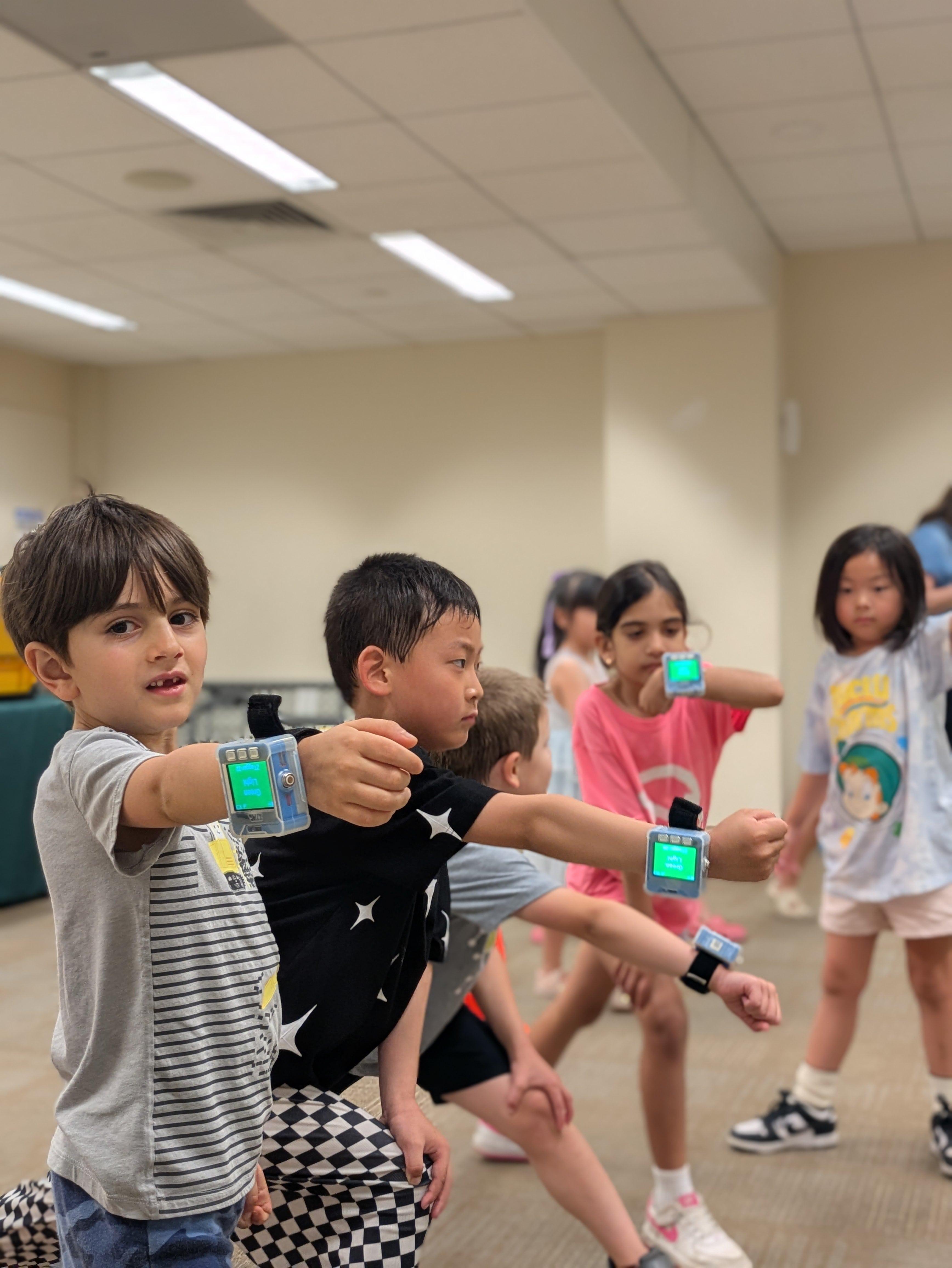 a group of kids playing ZTAG in the library.